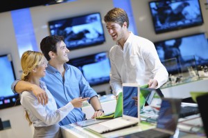 Young couple in consumer electronics store